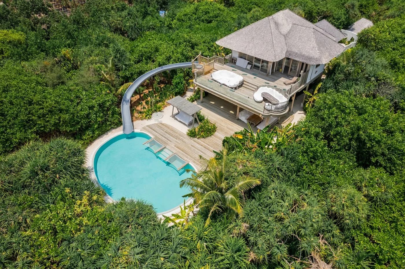 Soneva Jani overwater villa with private slide — Maldives ultra-luxury honeymoon